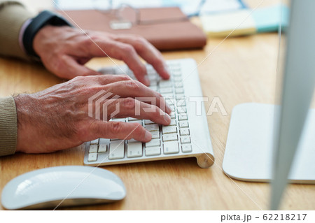 Software engineer typing on keyboard 62218217