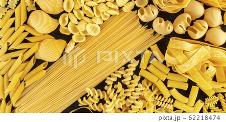 Pasta variety panorama, many different pasta sorts, shot from above on a black background Pasta variety panorama, many different pasta sorts, shot from above on a black background 62218474