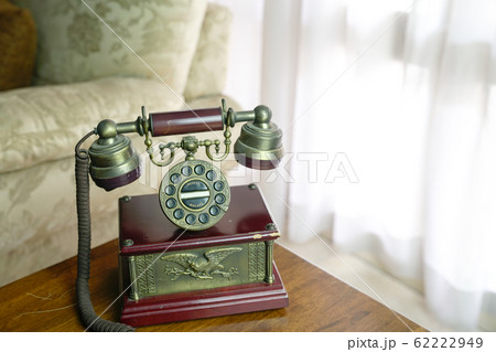 Classic vintage phone on a wooden top Classic vintage phone on a wooden top 62222949