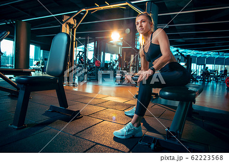 The female athlete training hard in the gym. Fitness and healthy life concept. 62223568