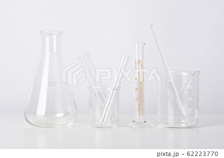 Group of scientific laboratory glassware with clear liquid solution. 62223770