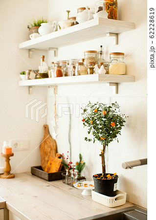 Modern white interior of kitchen with christmas decor. Modern white interior of kitchen with christmas decor. 62228619