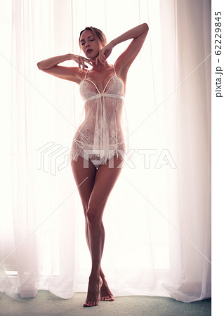 Defocus. High key light silhouette of a beautiful 62229845