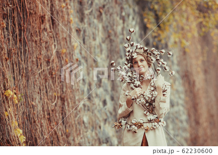 Beauty and nature. Tender woman with cotton flowers. Beauty and nature. Tender woman with cotton flowers. 62230600