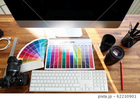 Color book with color trends sign on designer wooden table 62230901