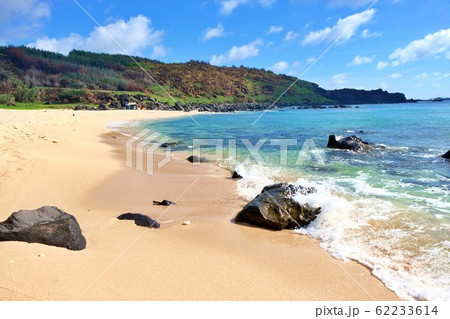 The beach with rock yellow sand and clear water under blue sky on a sunny day 62233614