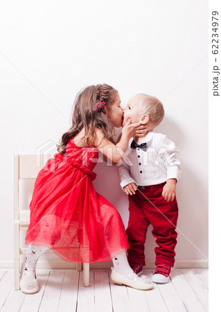 Family look brother and sister are kissing 62234979