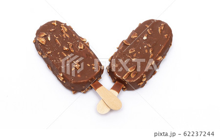 Chocolate ice cream with nuts on a stick. Isolated Chocolate ice cream with nuts on a stick. Isolated 62237244