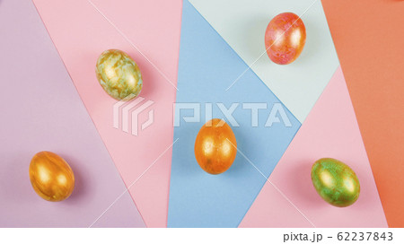 Easter eggs of different colors on the background Easter eggs of different colors on the background 62237843