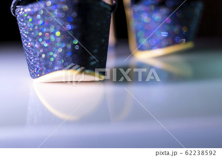 Sexy high heel shoes sparkle with colorful lovely glints in bokeh Sexy high heel shoes sparkle with colorful lovely glints in bokeh 62238592