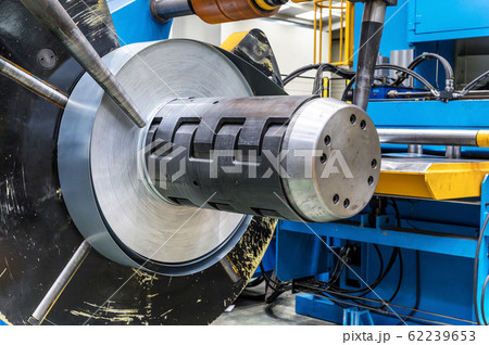 Industrial metal sheet coils connected with metal sheet profile forming machine. Industrial metal sheet coils connected with metal sheet profile forming machine. 62239653