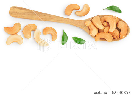 Roasted Cashew nuts in spoon isolated on white background with clipping path and full depth of field. Top view with copy space for your text. Flat lay Roasted Cashew nuts in spoon isolated on white background with clipping path and full depth of field. Top view with copy space for your text. Flat lay 62240858