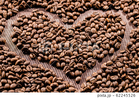 The fried coffee beans lie in the shape of a The fried coffee beans lie in the shape of a 62245526