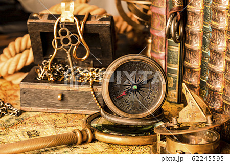 Antique compass on the background of a treasure 62245595