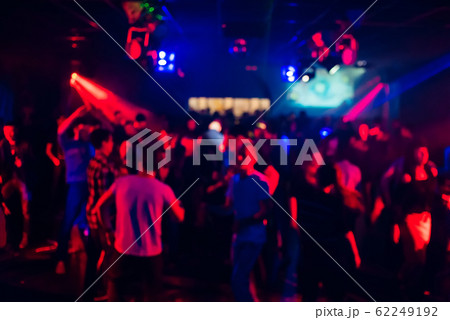 blurred silhouettes of people dancing in a nightclub blurred silhouettes of people dancing in a nightclub 62249192