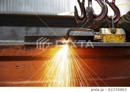 Industrial Worker at the factory welding closeup light sparks 62250863
