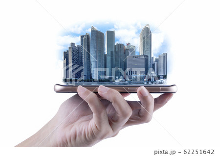 A Man hand holding the modern building of Business financial district and commercial on smartphone , concept of industrial construction and success with technology 62251642