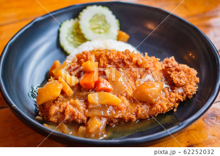 Crispy fried pork cutlet with curry and rice. Crispy fried pork cutlet with curry and rice. 62252032