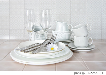 Clean dishes on the kitchen table Clean dishes on the kitchen table 62255381