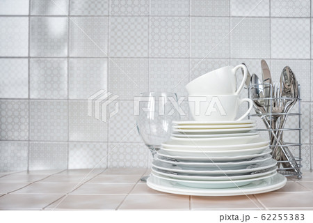Clean dishes on the kitchen table Clean dishes on the kitchen table 62255383