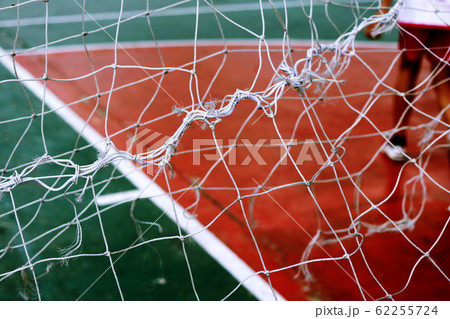 Football net and field football.Red Siemens and net on gate football. Football net and field football.Red Siemens and net on gate football. 62255724