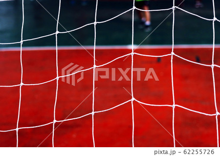 Football net and field football.Red Siemens and net on gate football. Football net and field football.Red Siemens and net on gate football. 62255726