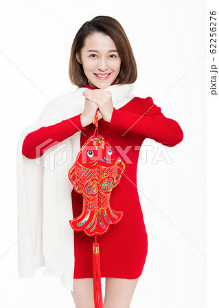 pretty girl holding chinese new year decoration 62256276