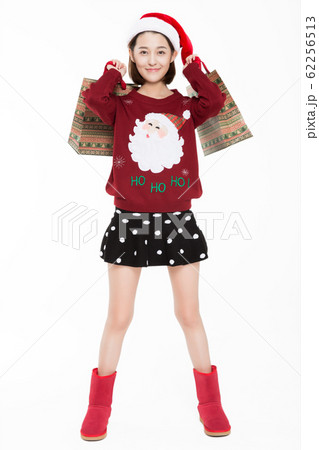 cheerful woman carrying shopping bags 62256513