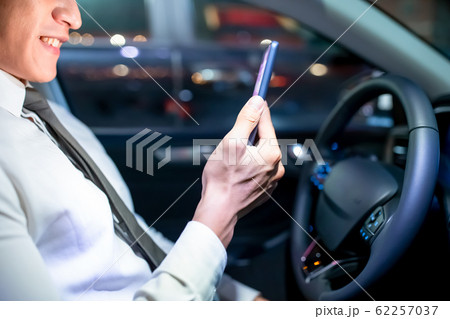businessman use smartphone in car businessman use smartphone in car 62257037