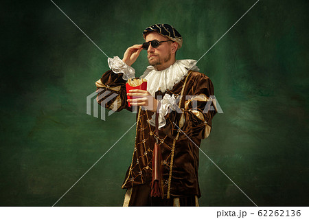 Medieval young man in old-fashioned costume 62262136