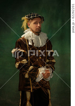 Medieval young man in old-fashioned costume 62262201