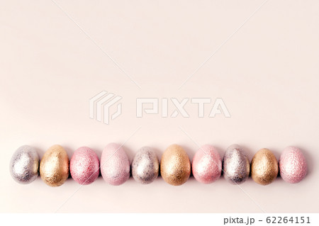 Colored chicken and quail eggs of pink, silver, golden, purple color Colored chicken and quail eggs of pink, silver, golden, purple color 62264151