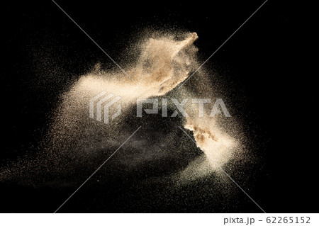 Brown colored sand splash.Dry river sand explosion isolated on black background. 62265152