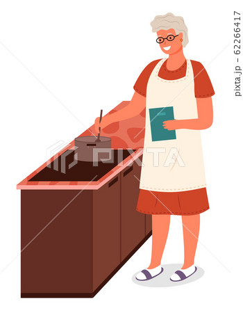 Senior Lady Cooking Soup Food in Kitchen at Home Senior Lady Cooking Soup Food in Kitchen at Home 62266417