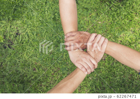 Authentic triangle partners hands together 62267471