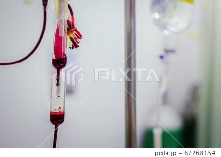 Closeup Blood transfusion intravenous to a patient in the hospital hand held shooting Closeup Blood transfusion intravenous to a patient in the hospital hand held shooting 62268154