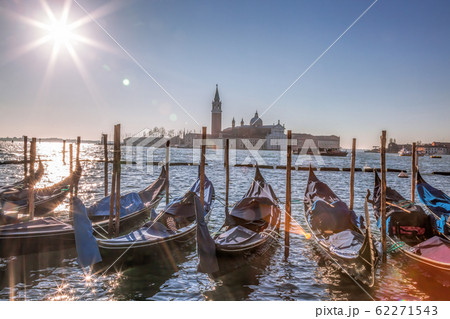 San Giorgio Maggiore Church with venetian gondolas at the harbor in Venice. Italy San Giorgio Maggiore Church with venetian gondolas at the harbor in Venice. Italy 62271543