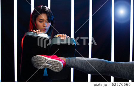 Girl exercises in Modern Neon Boxing Gym heavily Girl exercises in Modern Neon Boxing Gym heavily 62276666