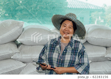 Smart farmer agriculturist with Organic Fertilizer Smart farmer agriculturist with Organic Fertilizer 62283156