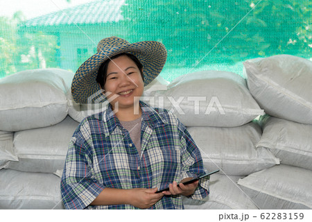 Smart farmer agriculturist with Organic Fertilizer Smart farmer agriculturist with Organic Fertilizer 62283159