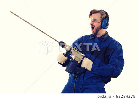 Crazy construction worker with a puncher on a 62284279