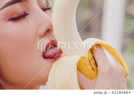 Woman is eating Banana for adult Sensuality Woman is eating Banana for adult Sensuality 62284864