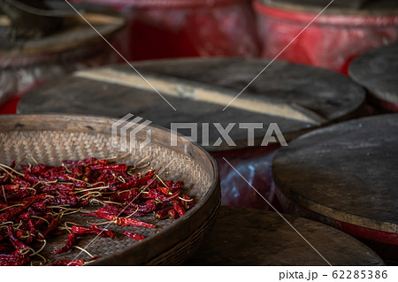 Chili drying in a wicker bowl Chili drying in a wicker bowl 62285386