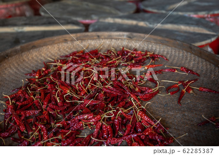Chili drying in a wicker bowl Chili drying in a wicker bowl 62285387
