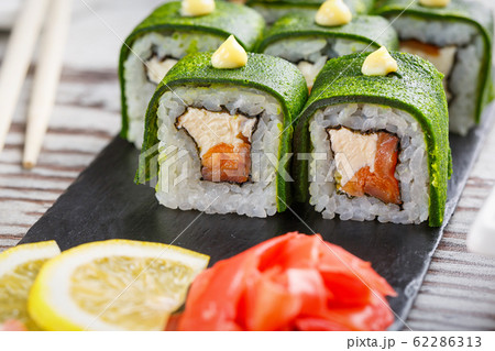 Sushi set on a black stone board. Japanese Sushi set on a black stone board. Japanese 62286313