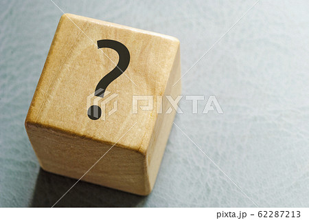 Wooden toy block with printed question mark Wooden toy block with printed question mark 62287213