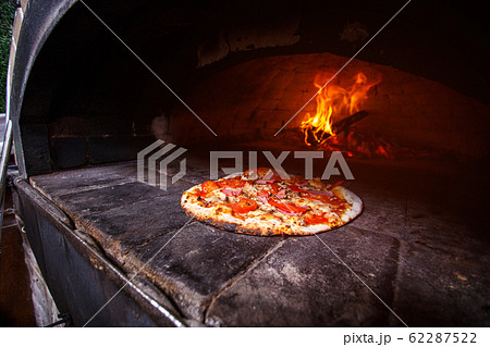 Pizza in the oven Pizza in the oven 62287522
