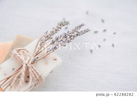 Three pieces of soap and dried herbs.  62288282