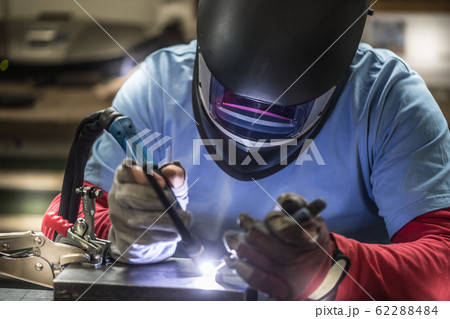 Welder industrial worker welding with argon Welder industrial worker welding with argon 62288484