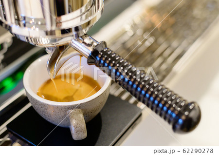 Coffee machine with stream coffee pouring in the cup Coffee machine with stream coffee pouring in the cup 62290278